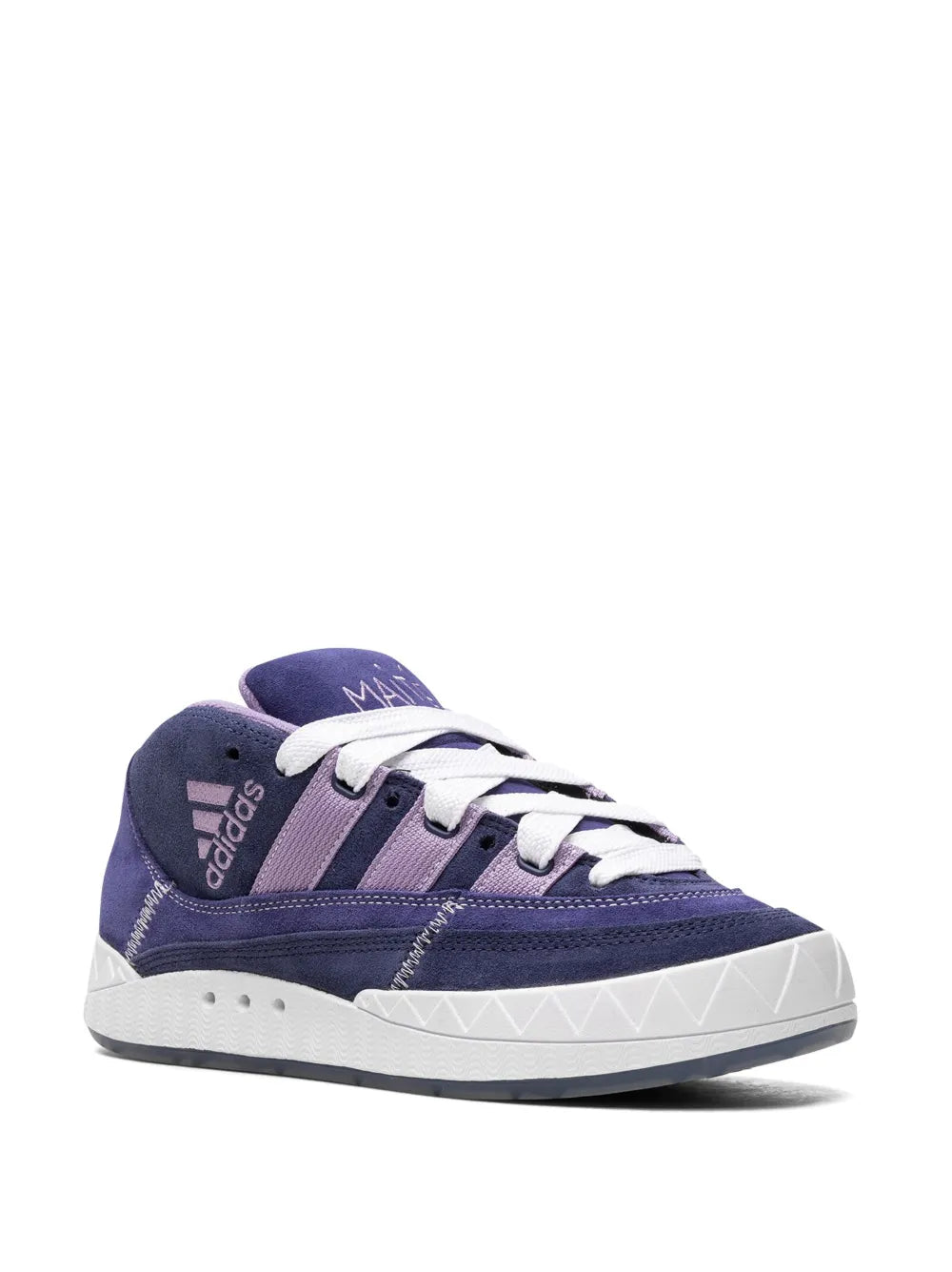Navy suede mid-top sneaker with white laces, light purple overlays and branding