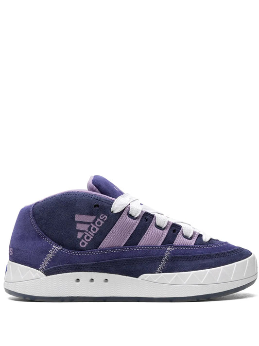 Navy suede mid-top sneaker with white laces and side stripes, white rubber sole