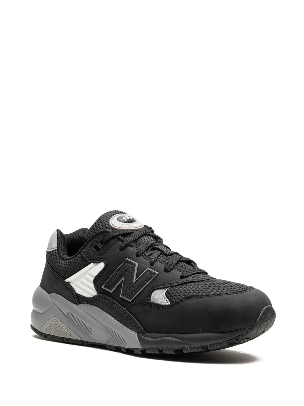 Black low-top sneakers with white N side logo, lace-up, gray traction outsole.