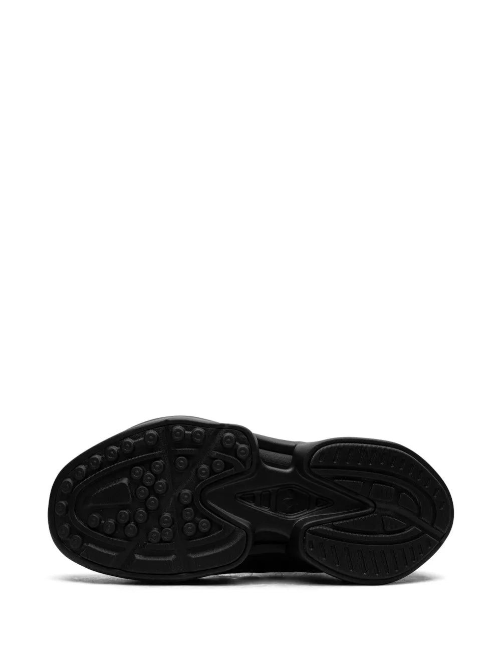 Black adidas sneaker outsole with textured rubber traction tread pattern
