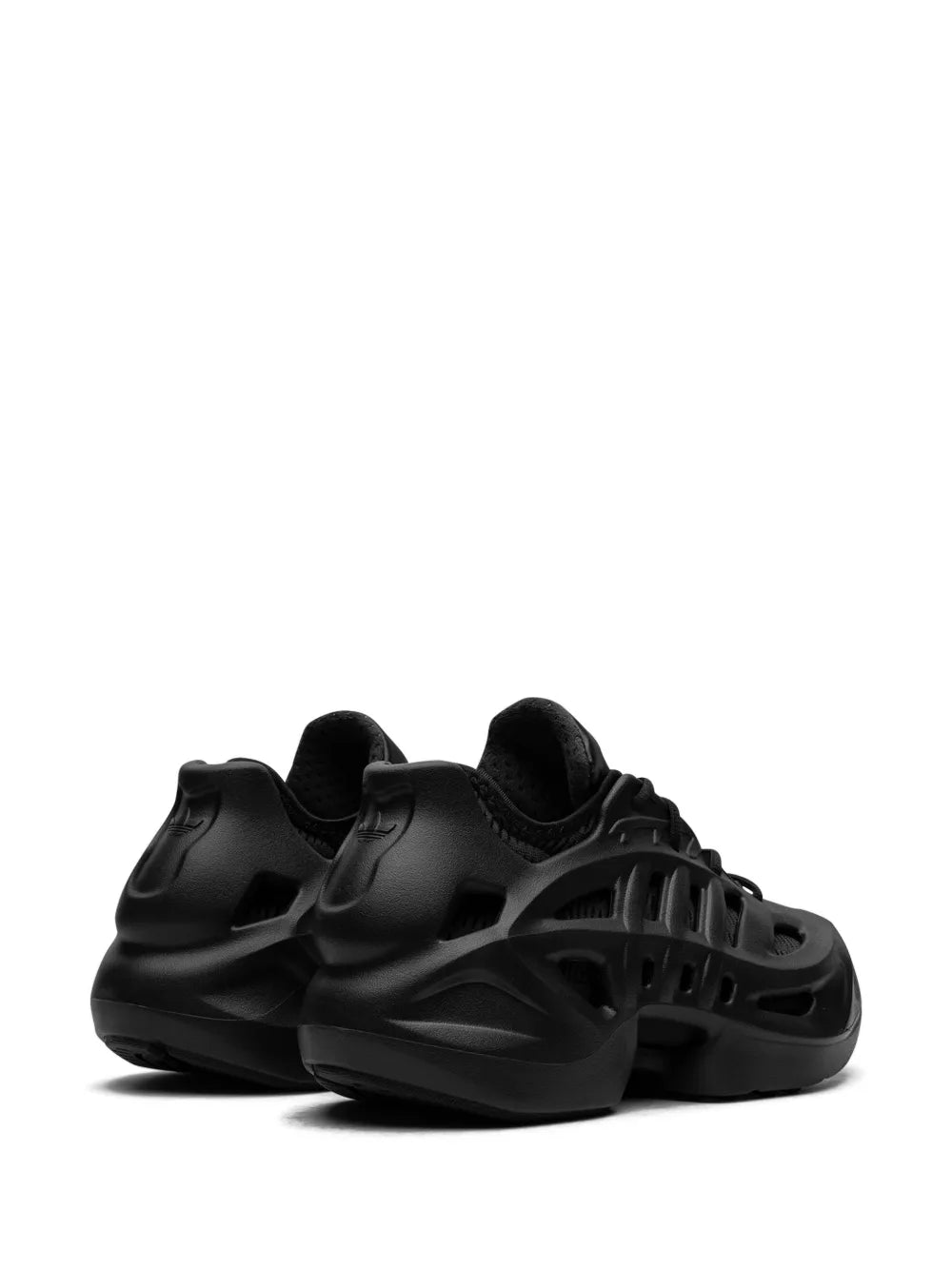 Black adidas sneakers showing side vent cutouts and low-profile padded collar