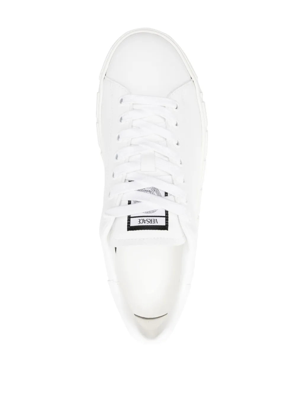 White leather low-top sneaker with black tongue label and lace-up front