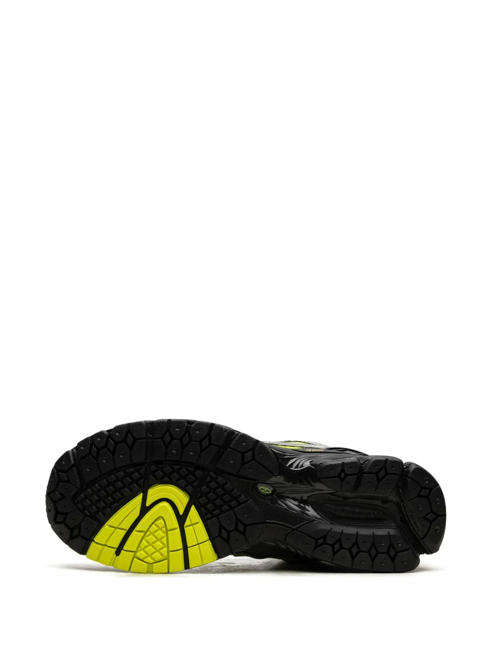 Neon-green and black New Balance sneaker outsole with tread pattern