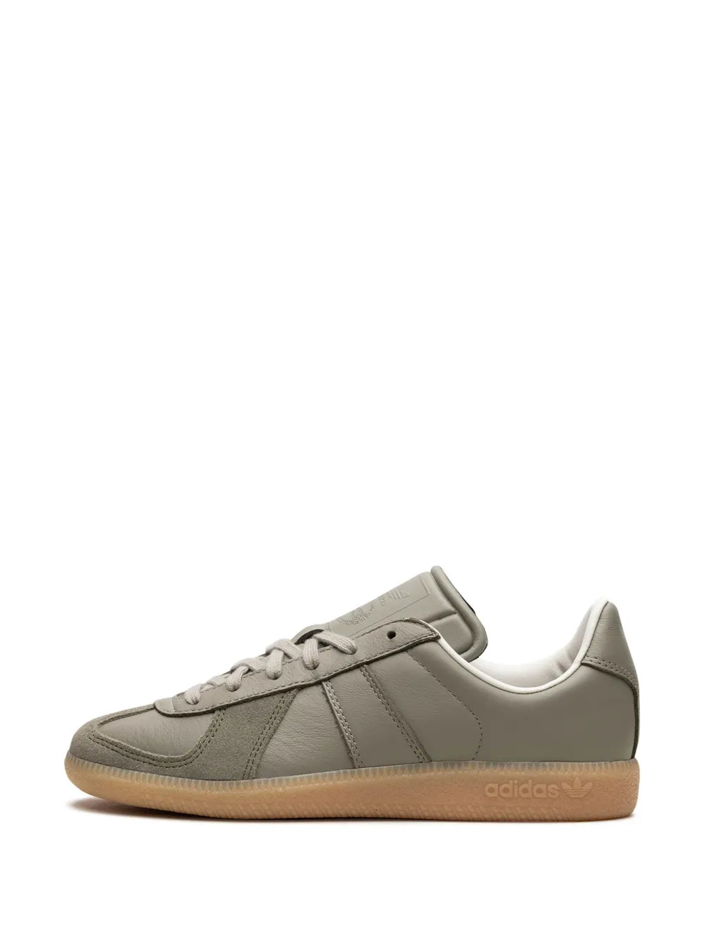 Gray low-top sneakers with lace-up, heel tab, and three stripes, gum sole