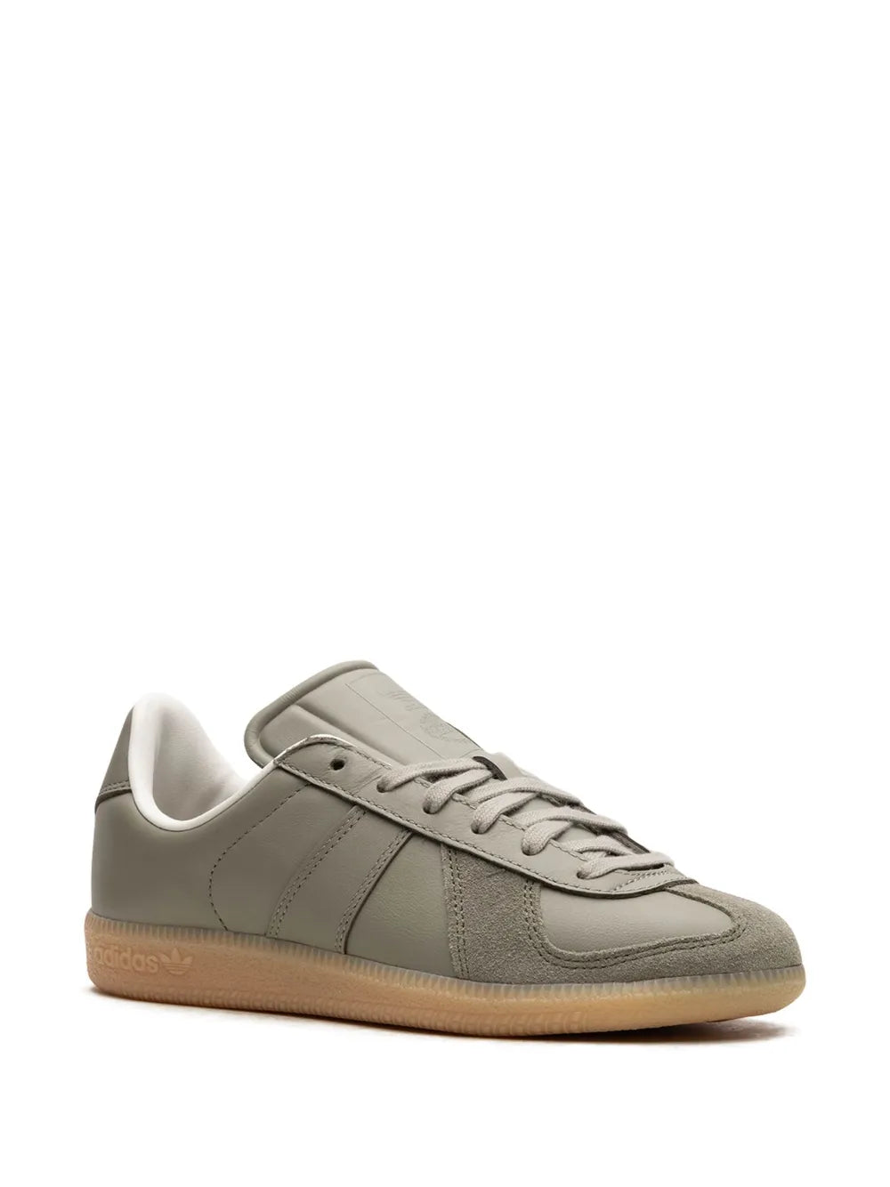 Low-top sneakers in gray with lace-up front and three side stripes, gum outsole