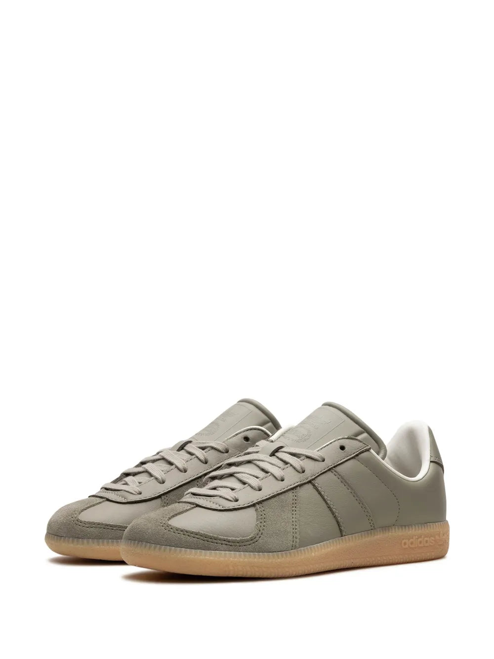 Low-top sneakers, gray upper with lace-up, panel seams, and gum sole
