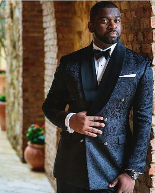 Men's dark patterned tuxedo with vest, bow tie, white shirt, and pocket square