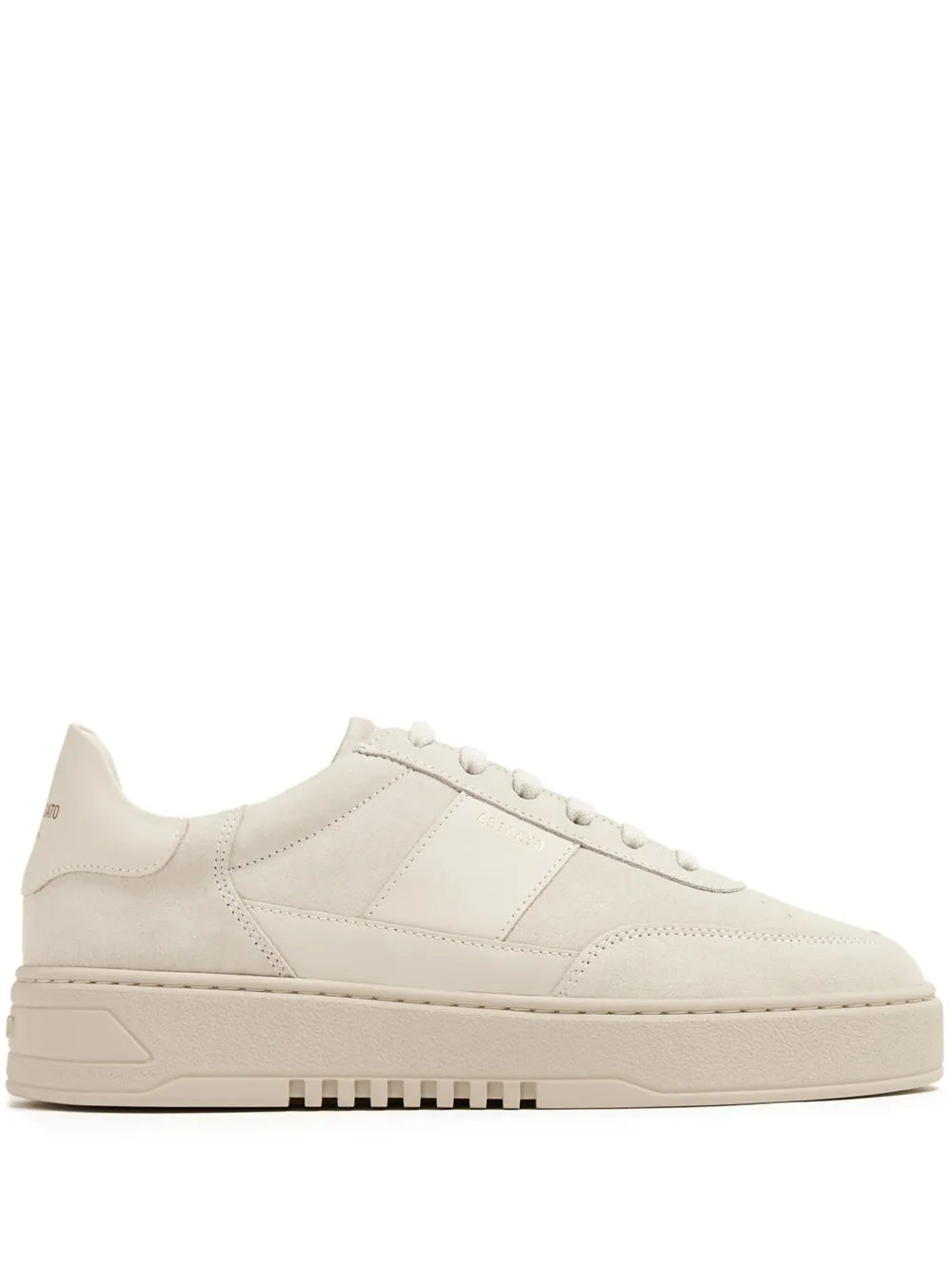 Light beige low-top lace-up sneakers with stitched panels and textured sole