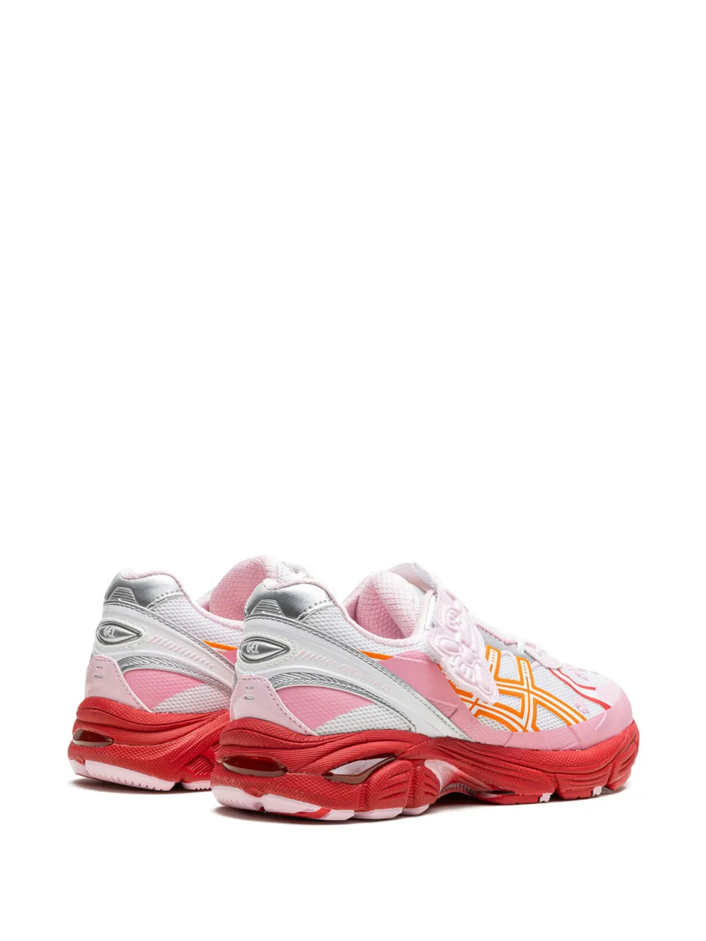 Side view of pink, white and orange low-top running shoe with lace-up and molded sole