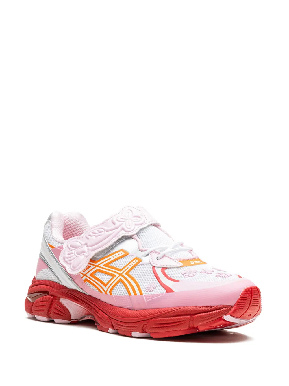 Pink and white low-top sneaker with orange logo accents, lace-up front and quilted detail