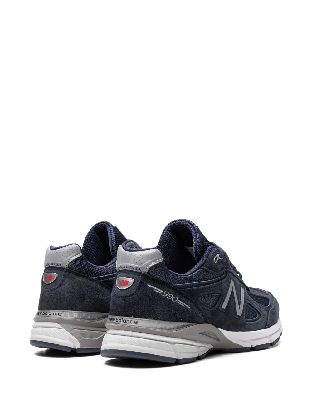Navy 990V4 sneakers with heel tab, N logo, and 990 branding