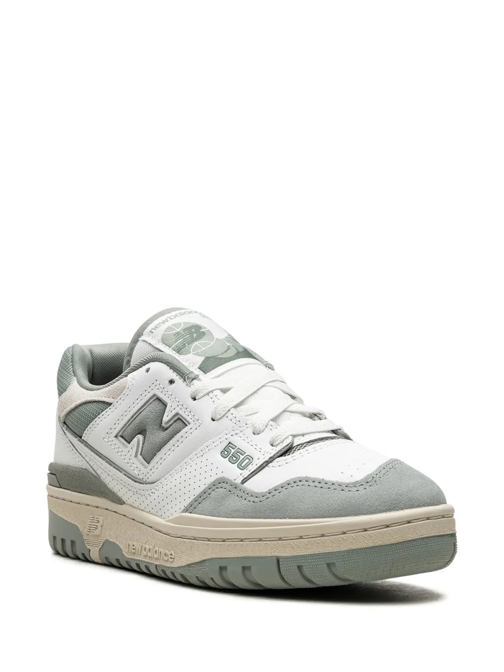 New Balance 550 sneakers, side view; white with seafoam green overlays and laces