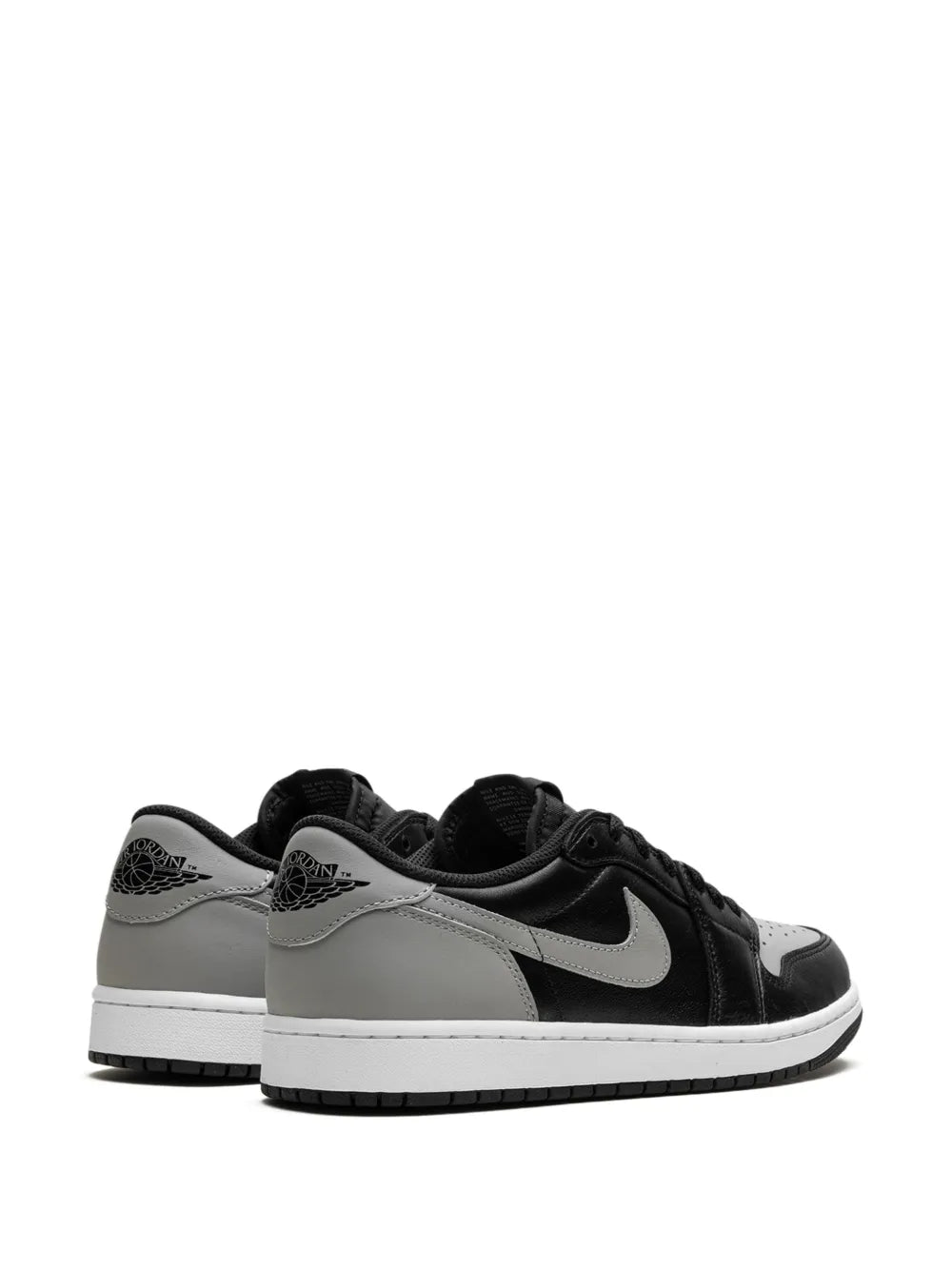 Black low-top sneakers with gray overlays and Nike Swoosh, front and heel view
