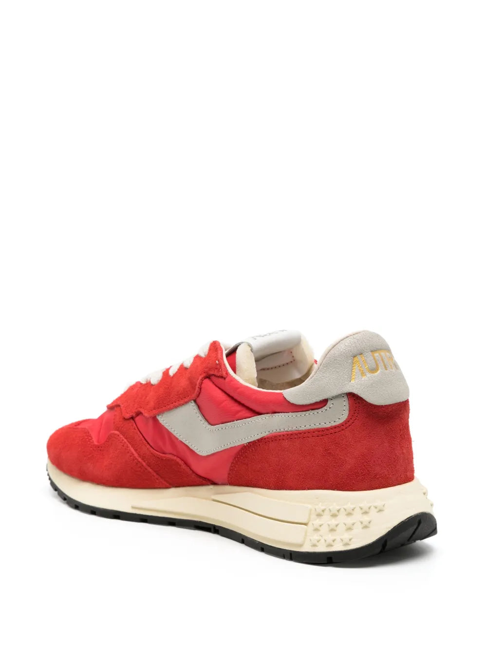 Red suede lace-up sneakers with light gray heel tab and cream midsole