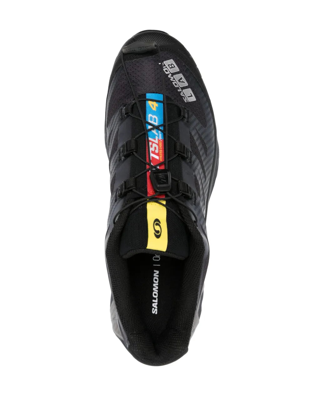 Salomon black shoe tongue and lace-up front with yellow accent strap