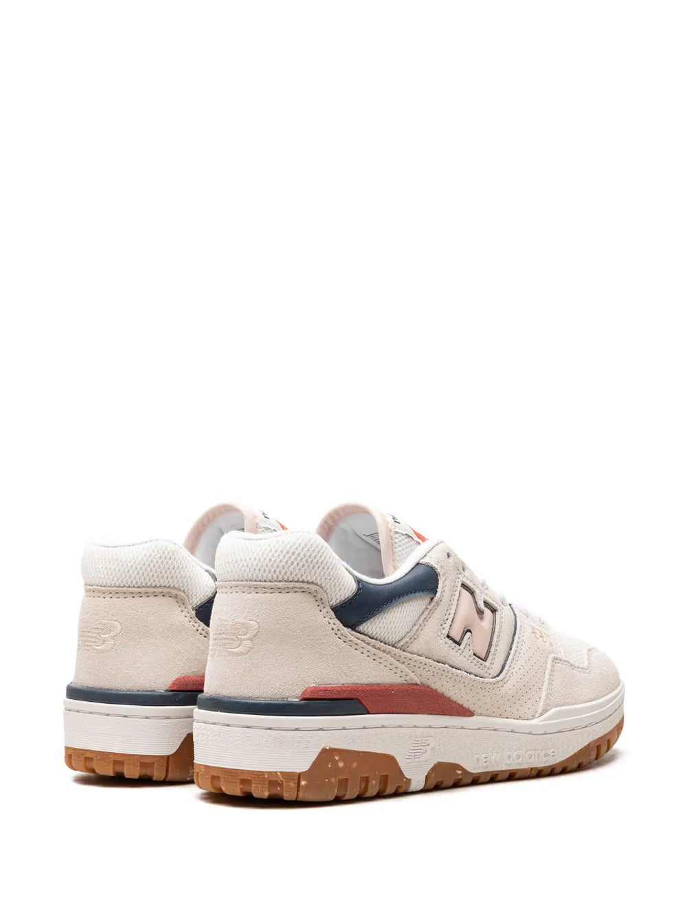 New Balance 550 sneaker back view, white upper with navy collar, red side accent