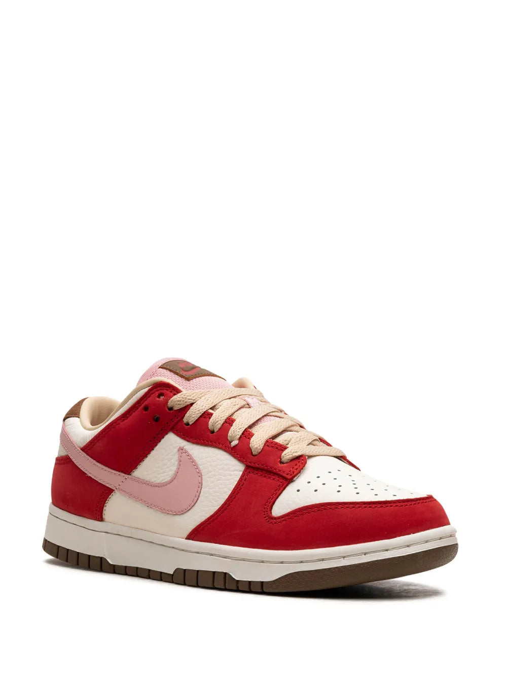 Red and white low-top Nike sneaker angled side view, lace-up with light pink swoosh