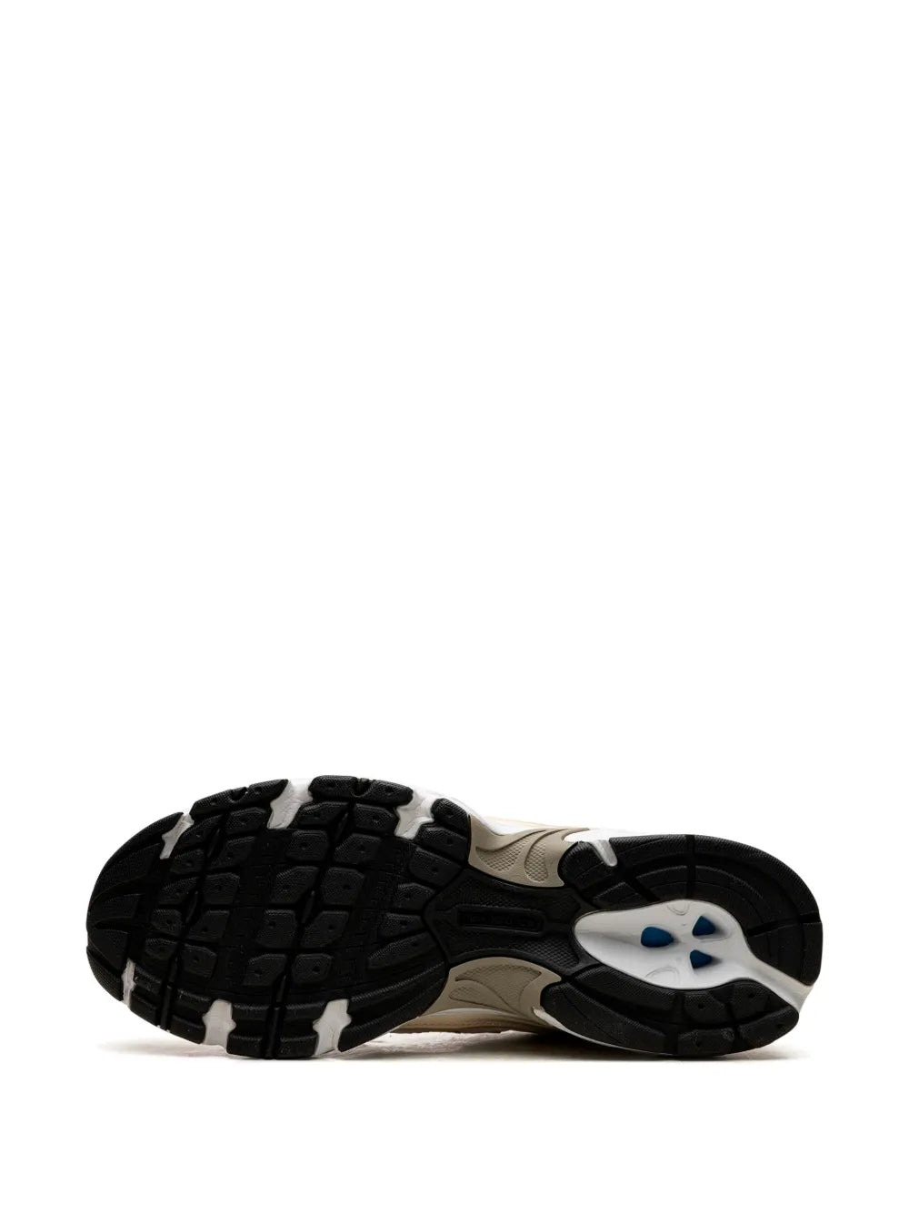Sneakers outsole with black tread pattern and New Balance heel branding