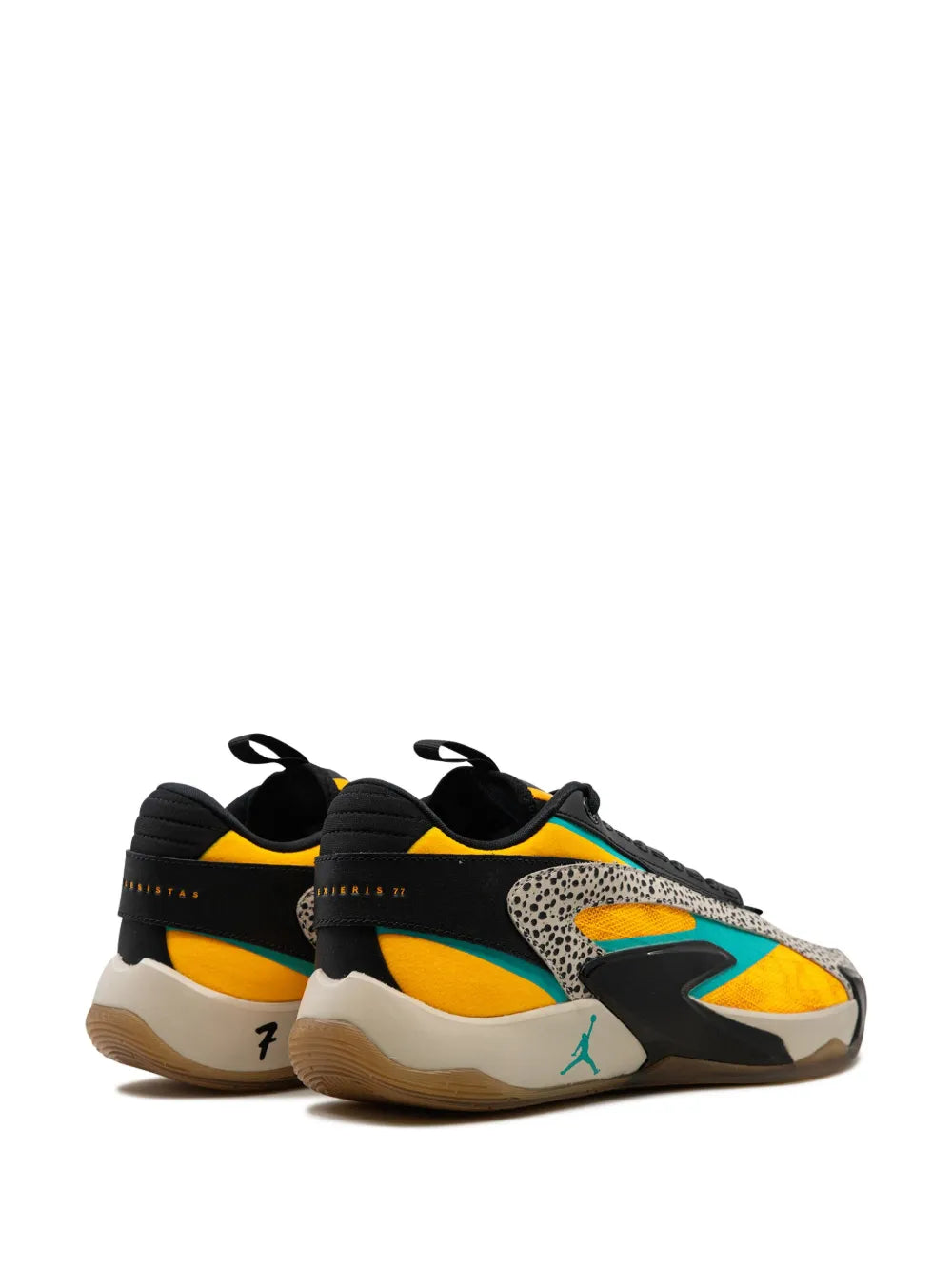 Pair of black low-top sneakers with yellow and aqua detailing and speckled overlays.