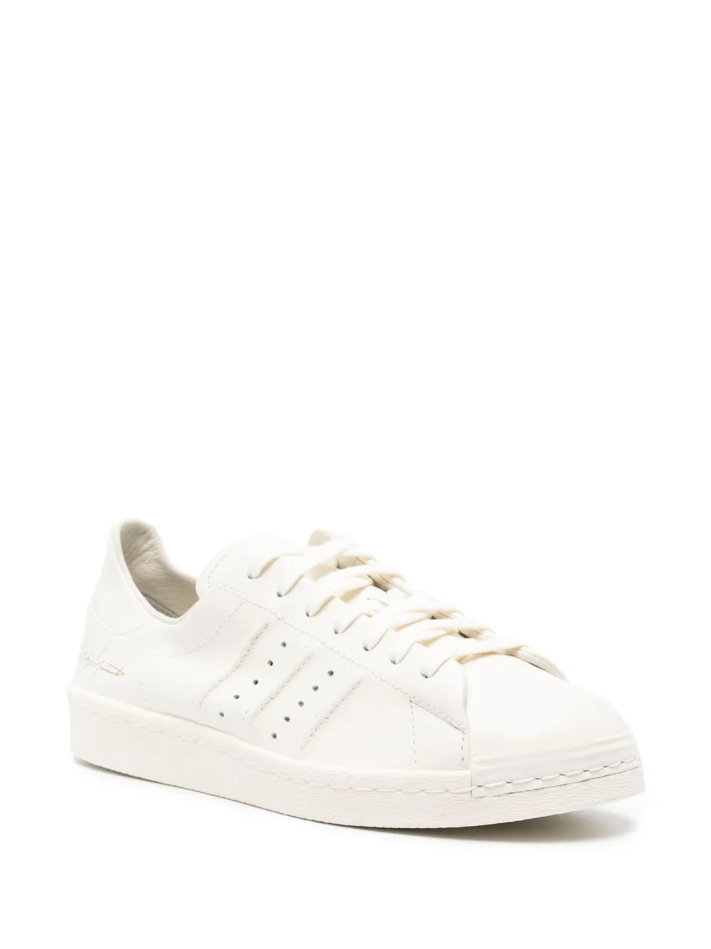 Y-3 Superstar leather sneakers in white, side view with perforated detailing