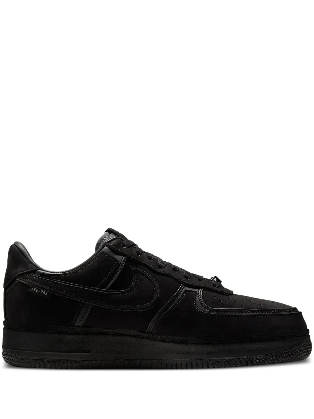 Black Nike low-top sneakers, leather look, lace-up with side swoosh