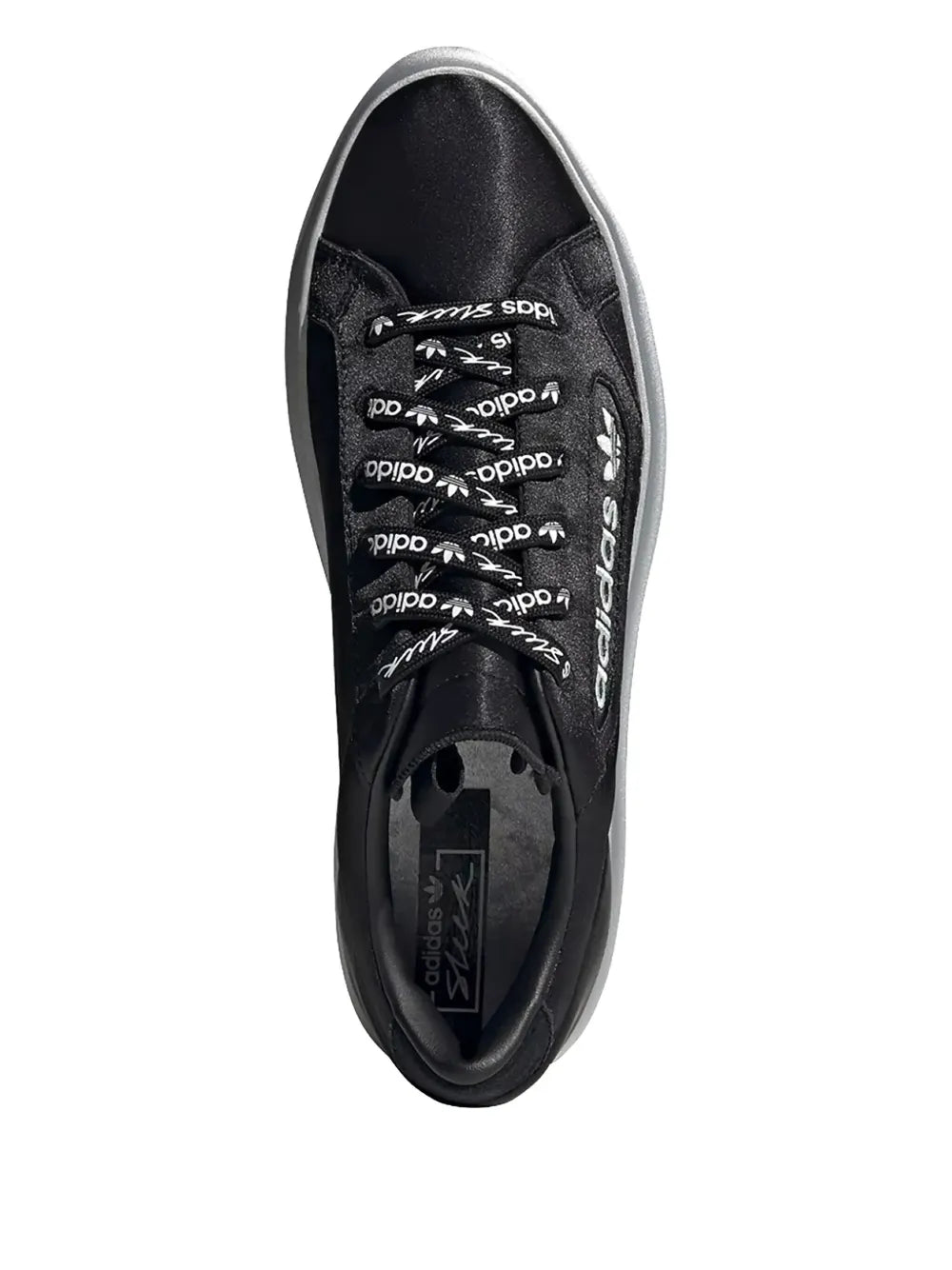 Black adidas low-top sneaker, lace-up side view with printed inner lining