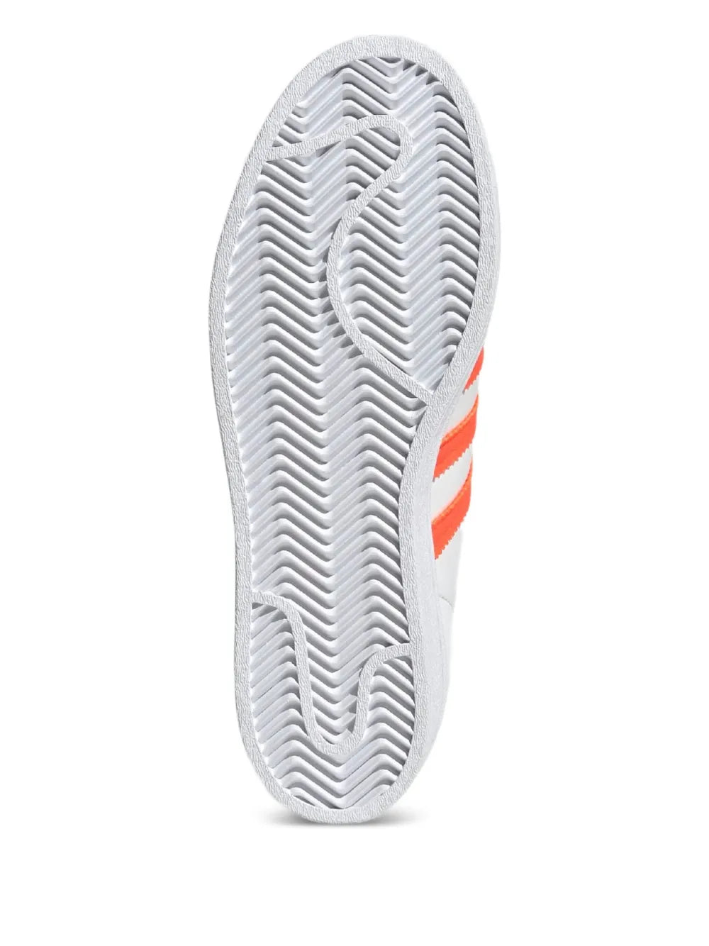 adidas Superstar outsole with white herringbone tread and orange stripe on heel