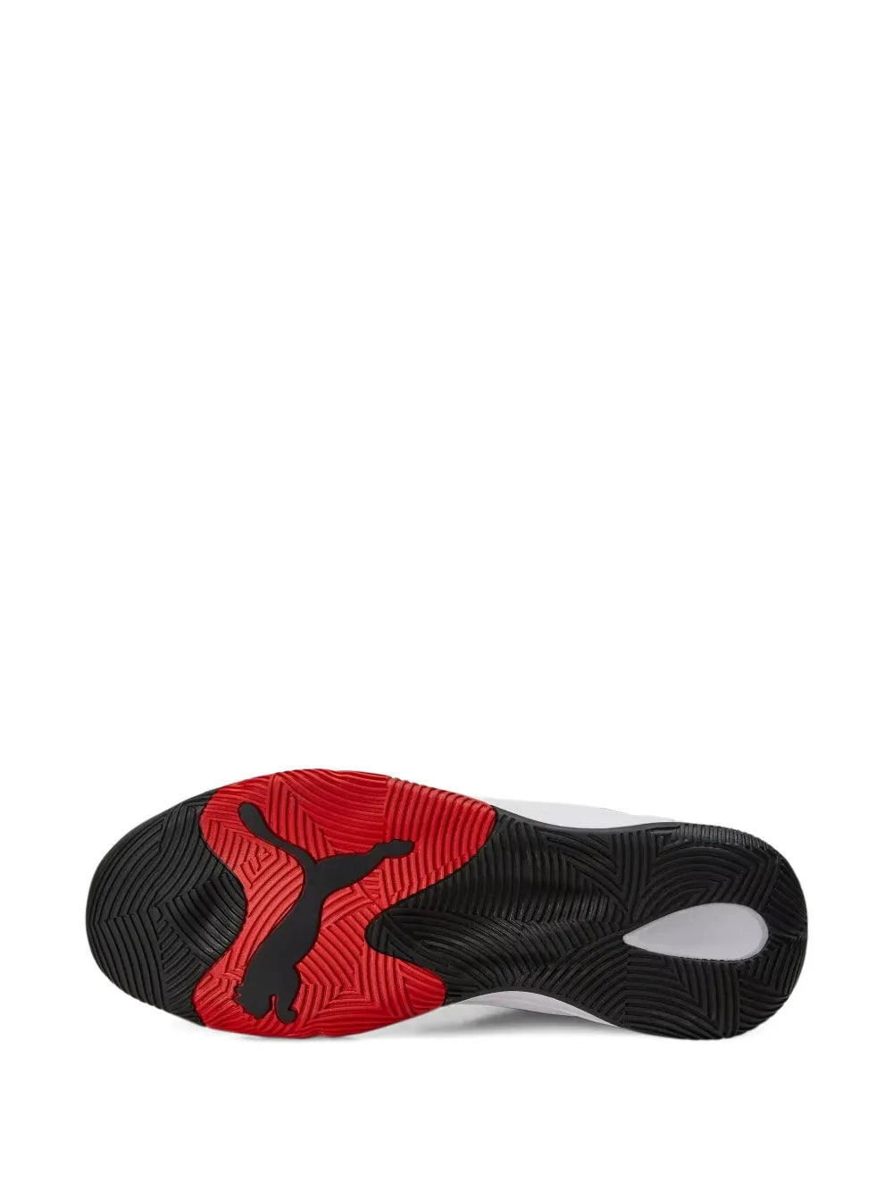 Black PUMA sneaker outsole with red traction pattern and white edge