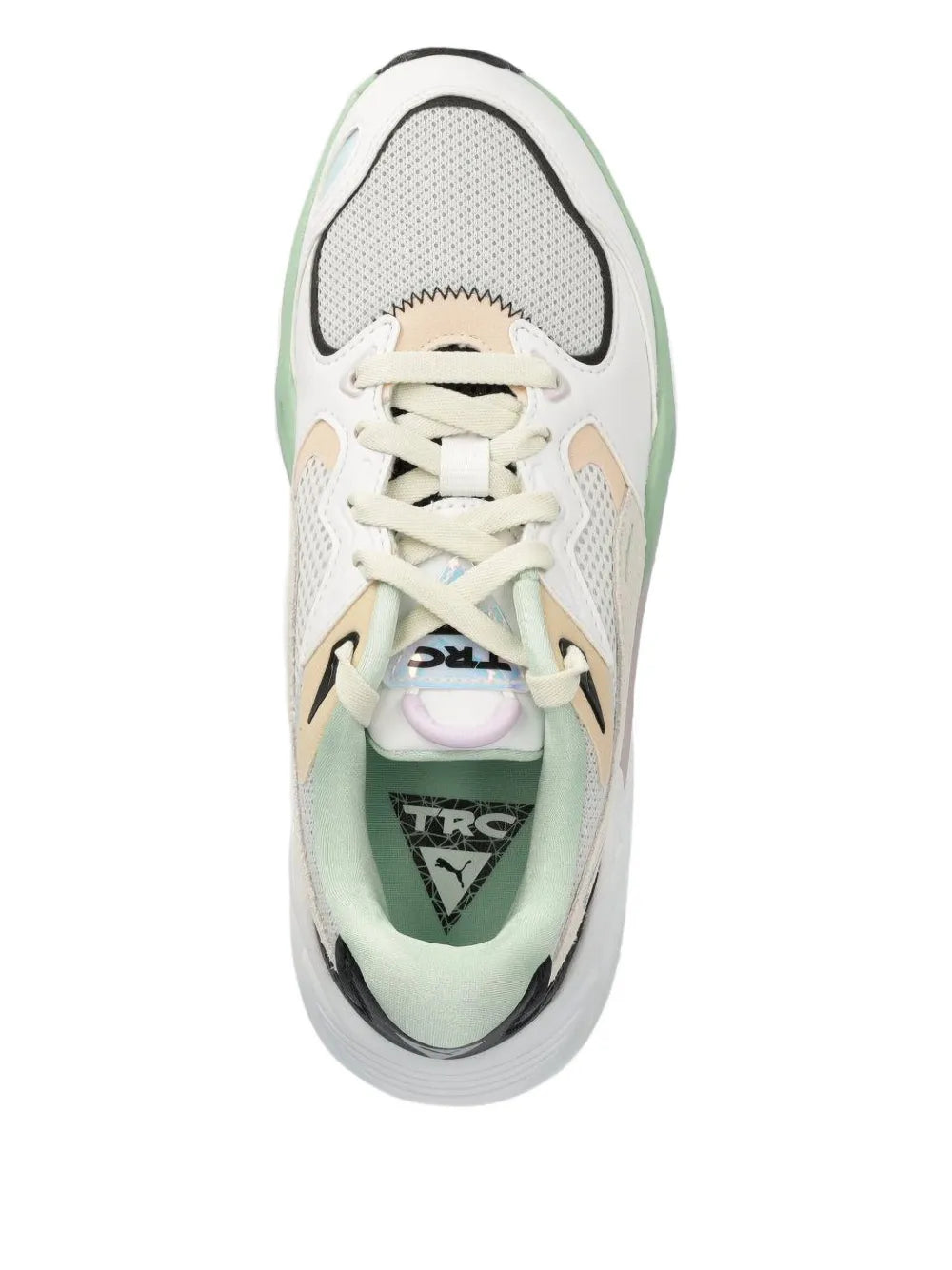 Sneaker toe view, white textile upper with beige eyelets and lace-up front