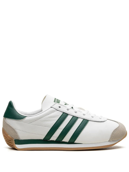 White leather low-top sneaker with green stripes and lace-up front, gum sole