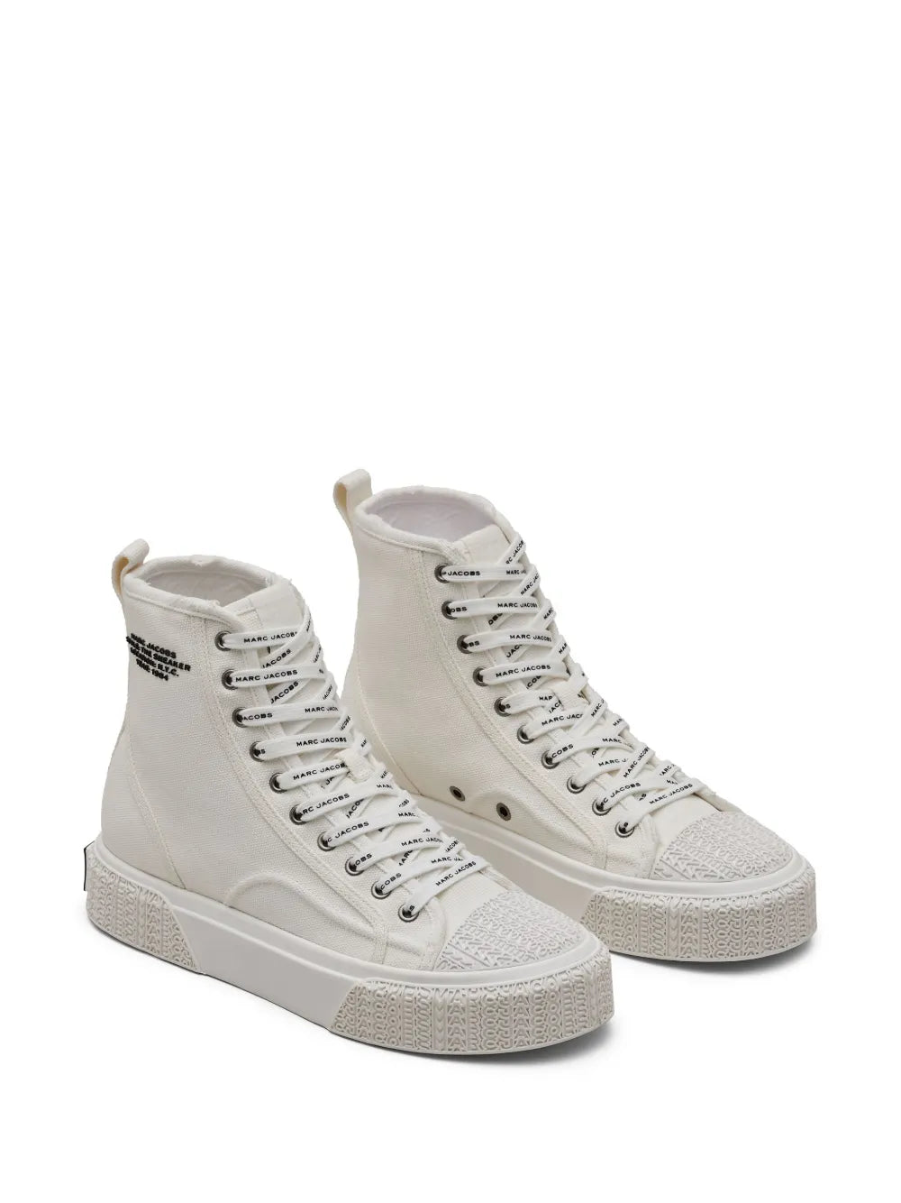 Pair of white high-top canvas sneakers with lace-up front and textured side panels
