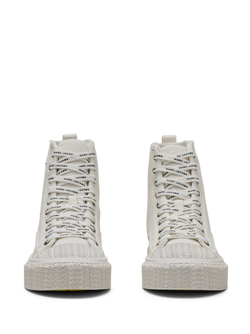 Front view of white high-top canvas sneakers with lace-up closure and textured sole