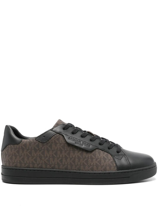 Black monogram-pattern sneakers with lace-up front and rubber cupsole