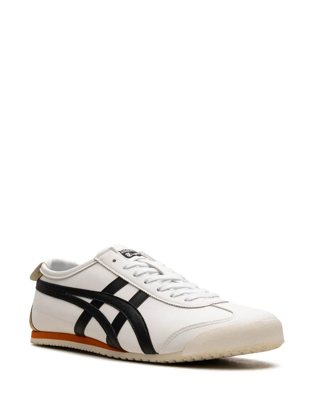 White low-top sneakers with black tiger-stripe overlays and white lace-up