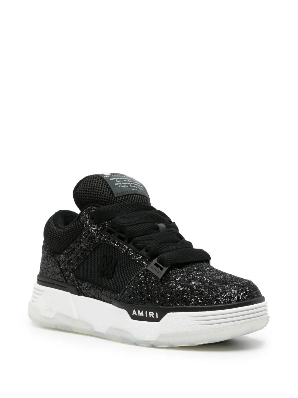 Black glittered low-top sneakers with side logo, padded tongue, and white sole