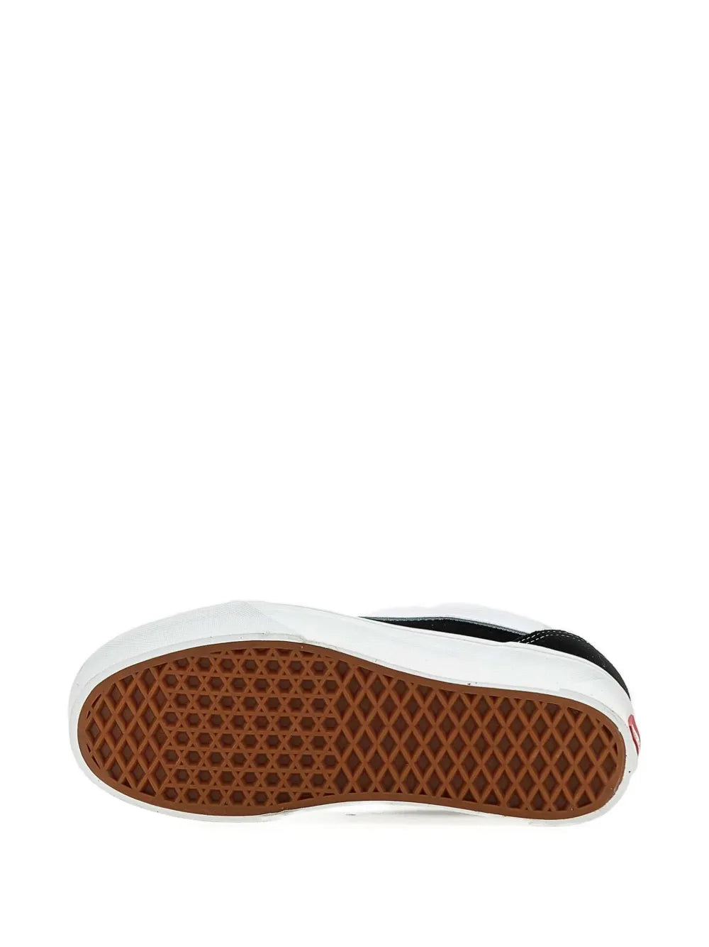 Vans low-top sneaker outsole with textured rubber tread, black and white