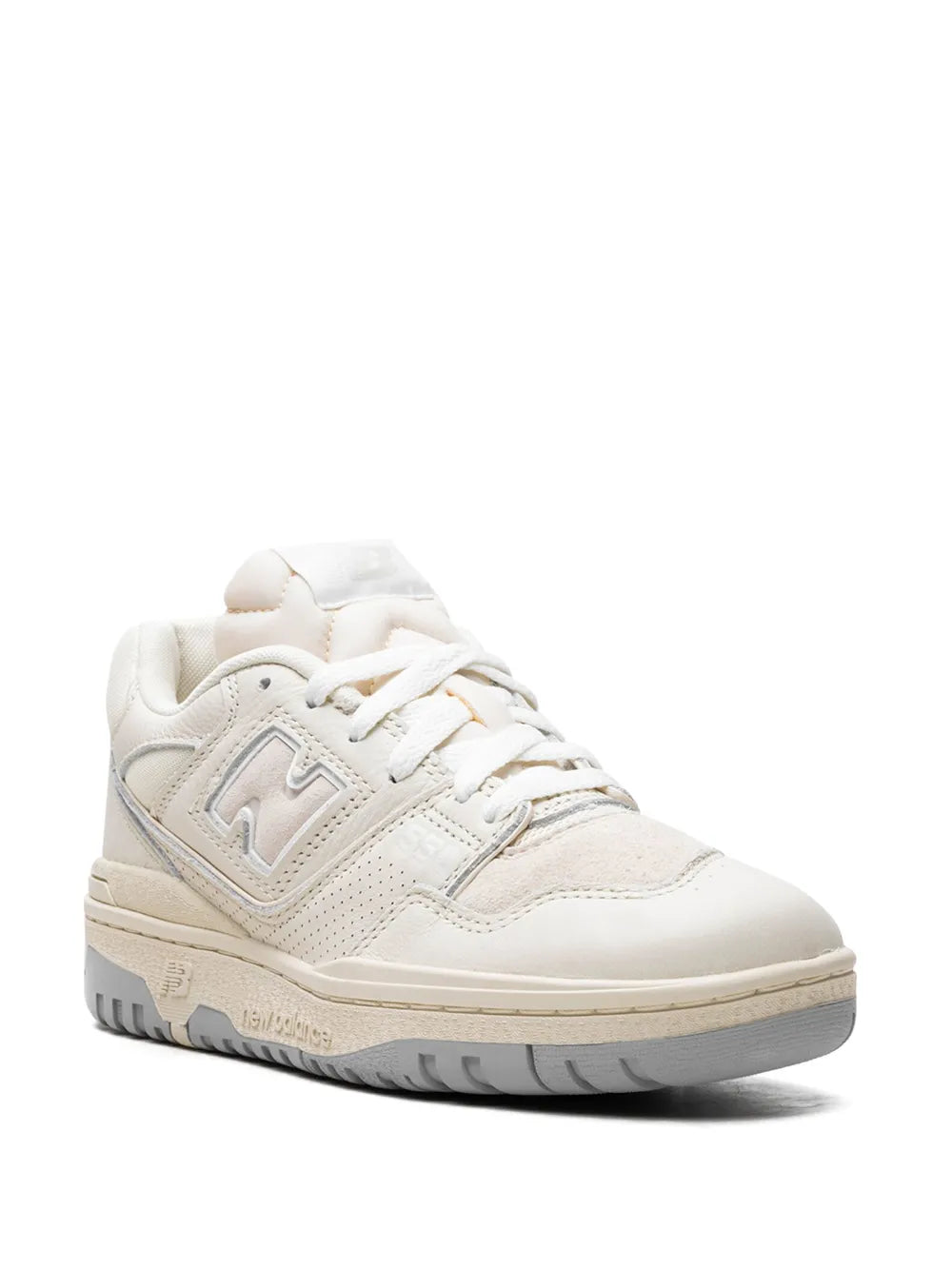 New Balance 550 white/cream lace-up sneakers, angled side view with textured panels