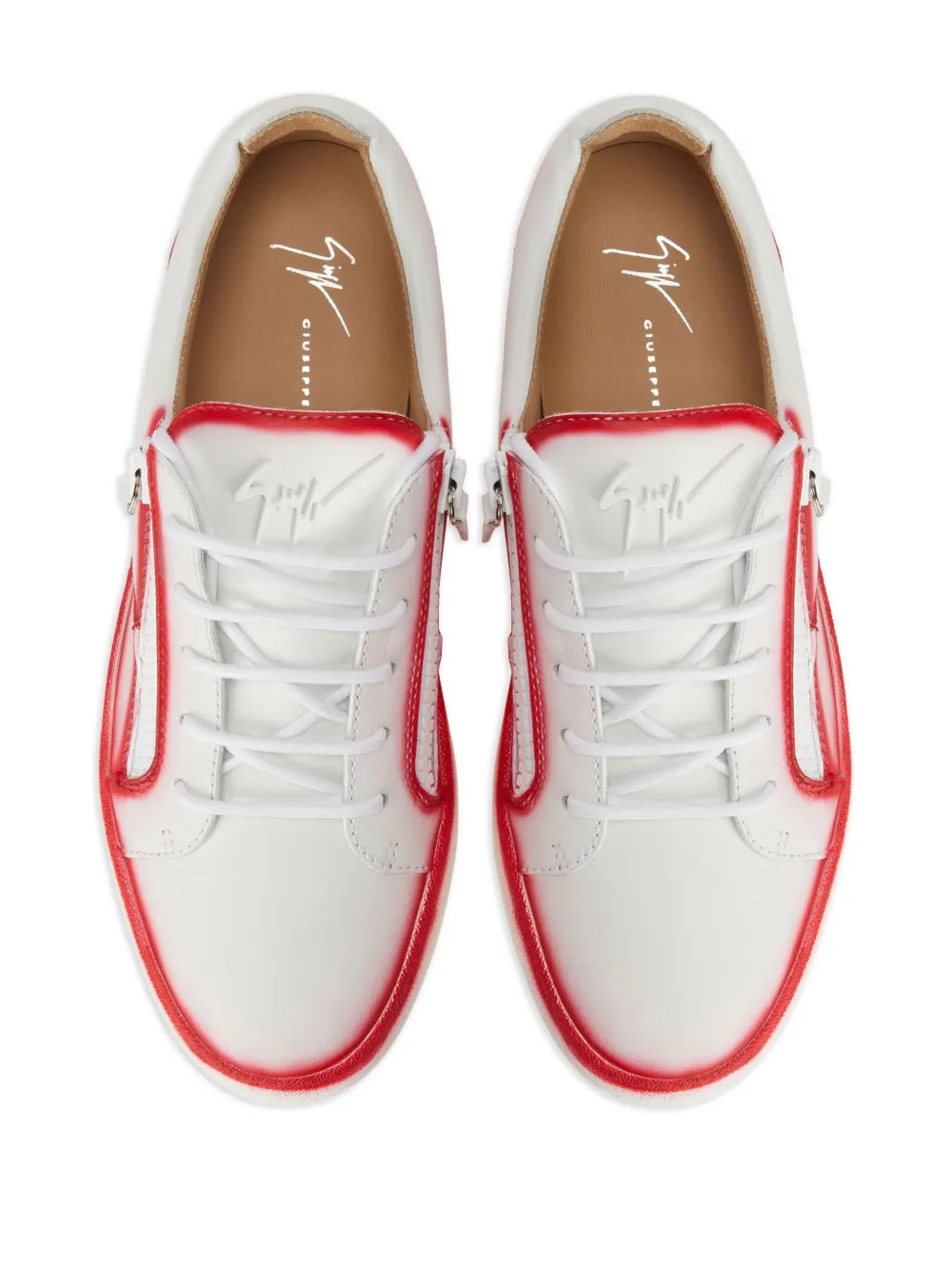 White low-top sneakers with red trim, lace-up front and side double zips