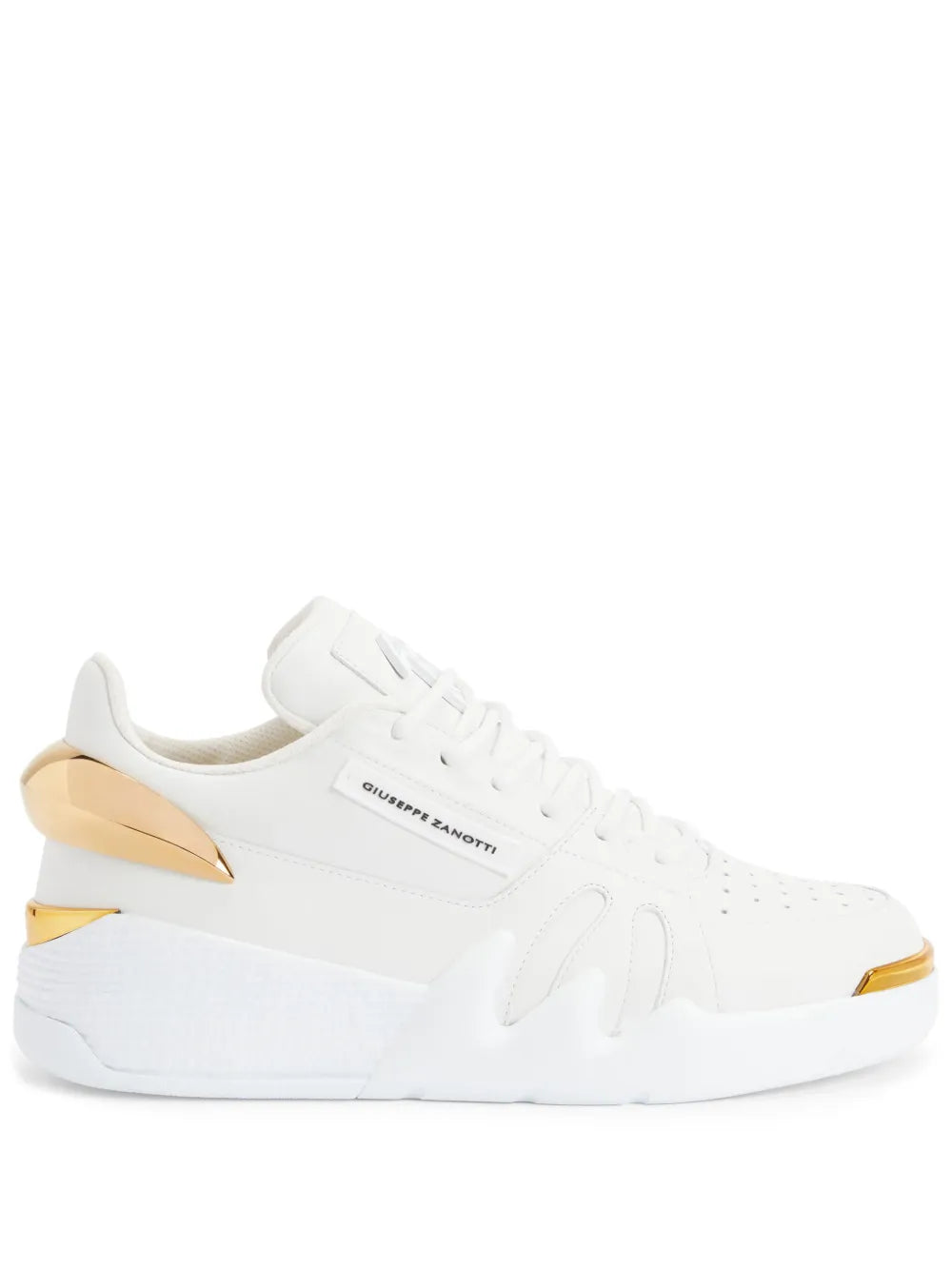 White low-top sneakers with gold hardware detail and perforated side panels