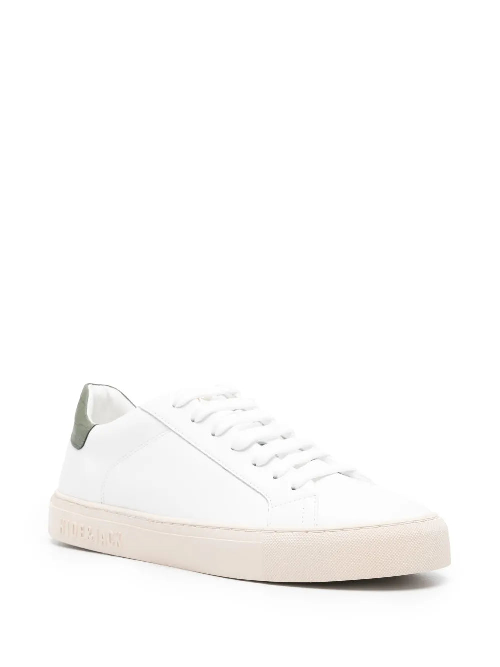White low-top sneakers with olive-green heel tab and lace-up, angled side view