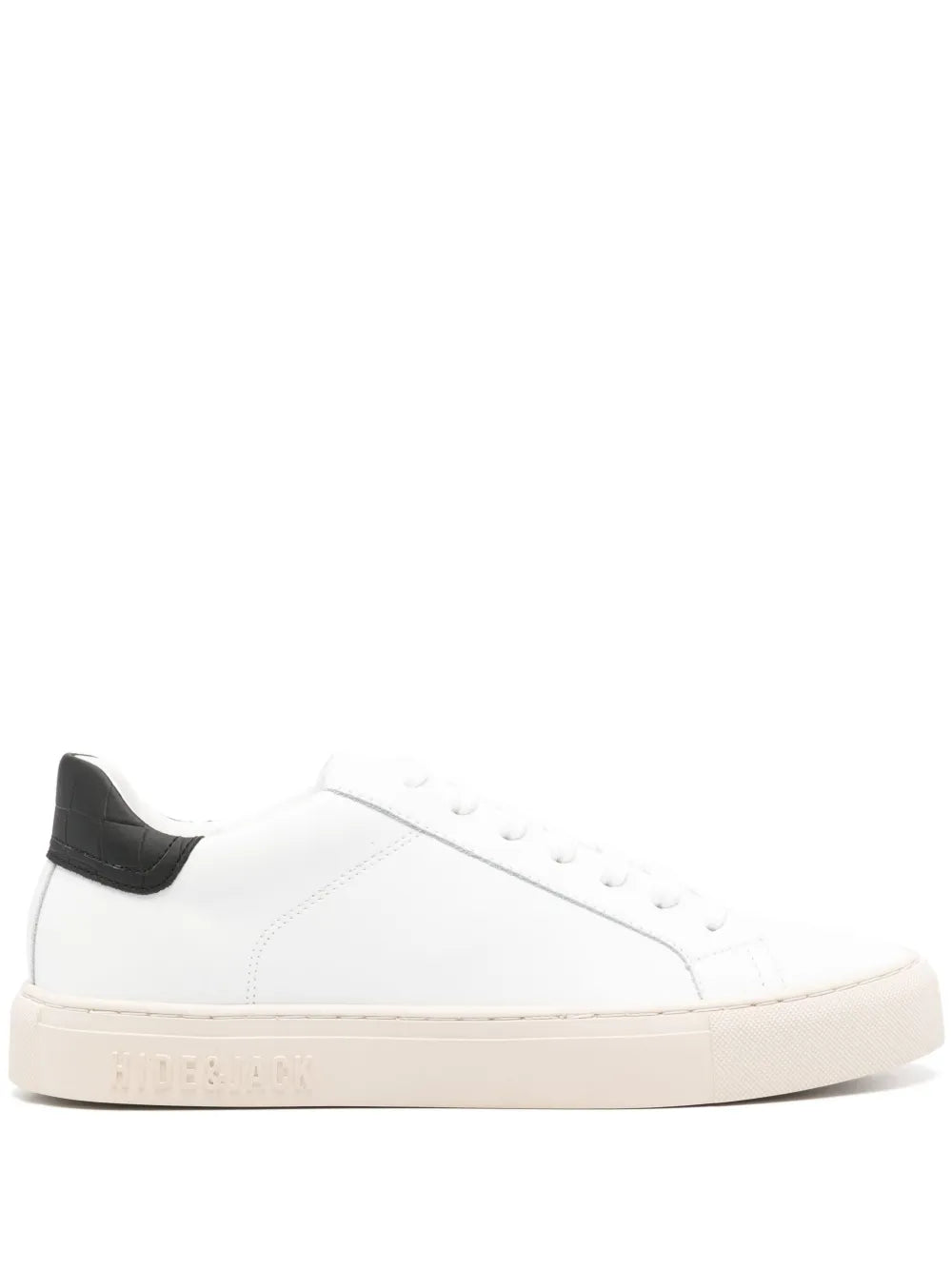 White leather low-top sneakers with black heel panel, lace-up, beige rubber sole