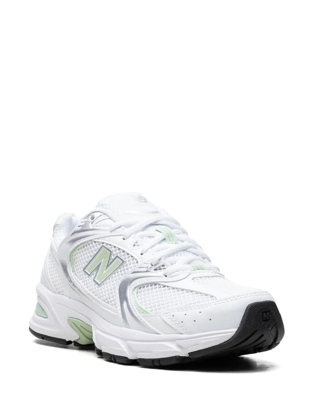New Balance sneakers, white upper with mint green details, front quarter view