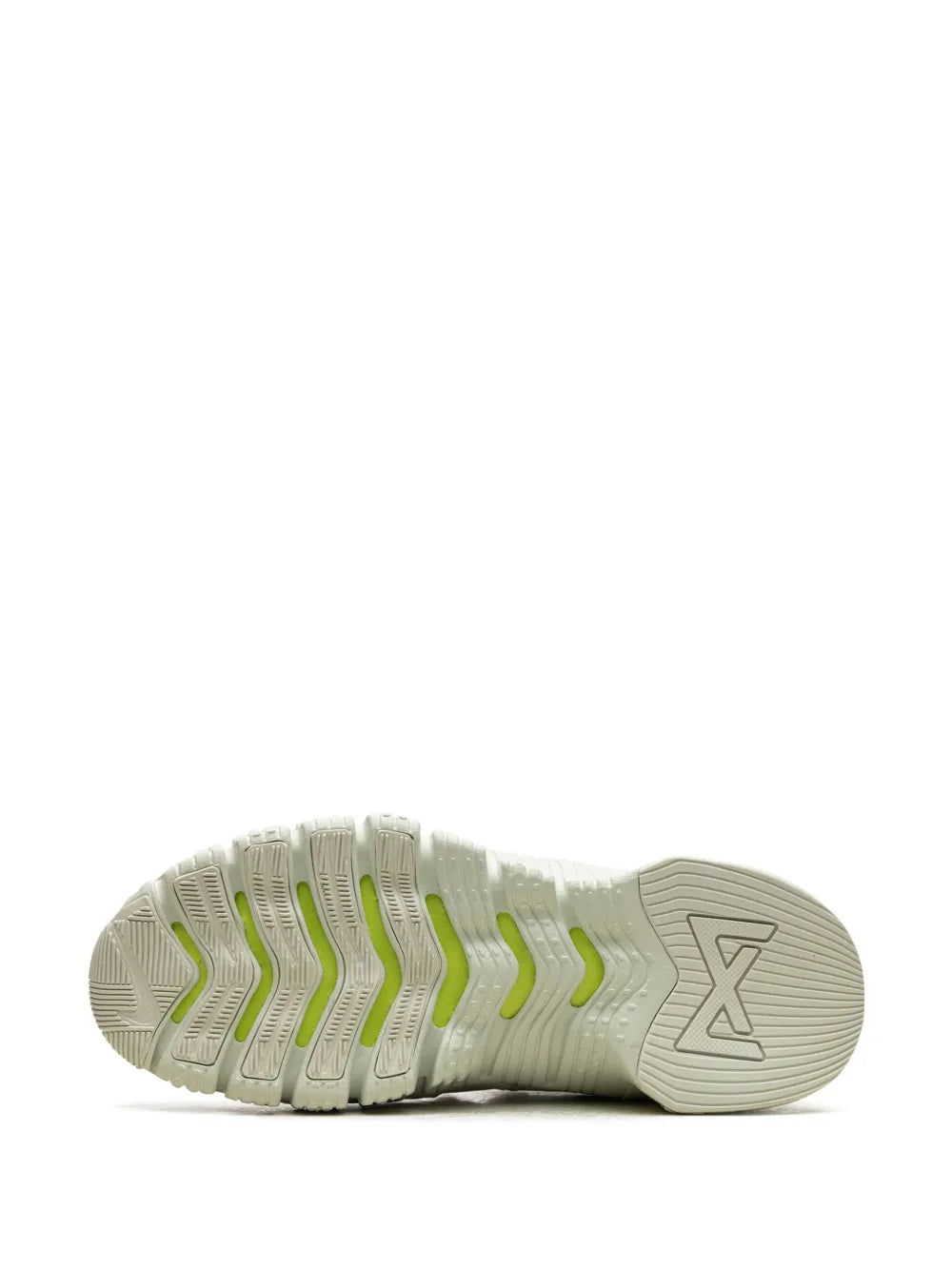 Nike white rubber outsole with ribbed traction and yellow accent lines