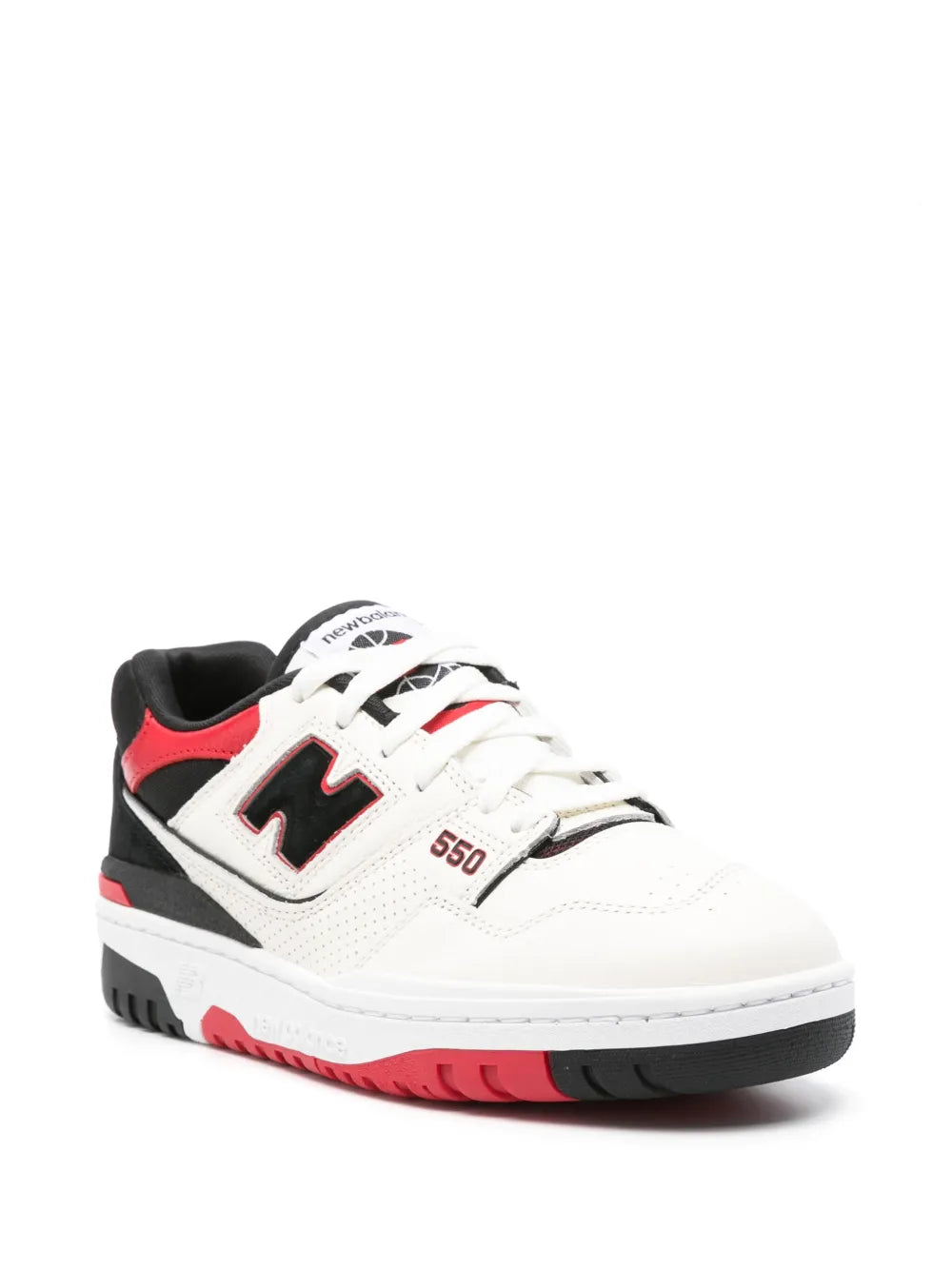 White lace-up New Balance 550 sneakers with black side panels and red accents