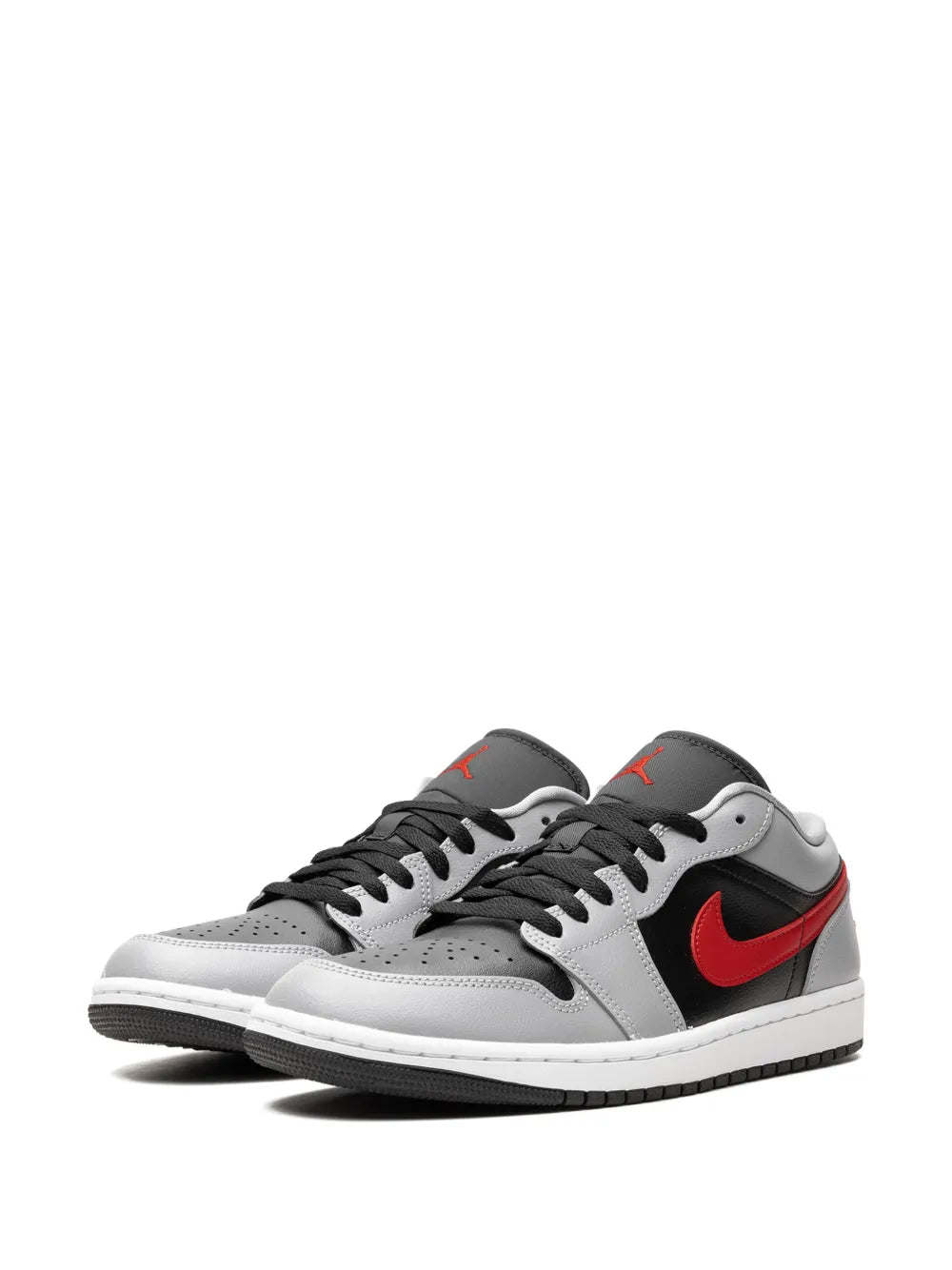 Air Jordan 1 sneakers with gray/white uppers, red swooshes, and black laces