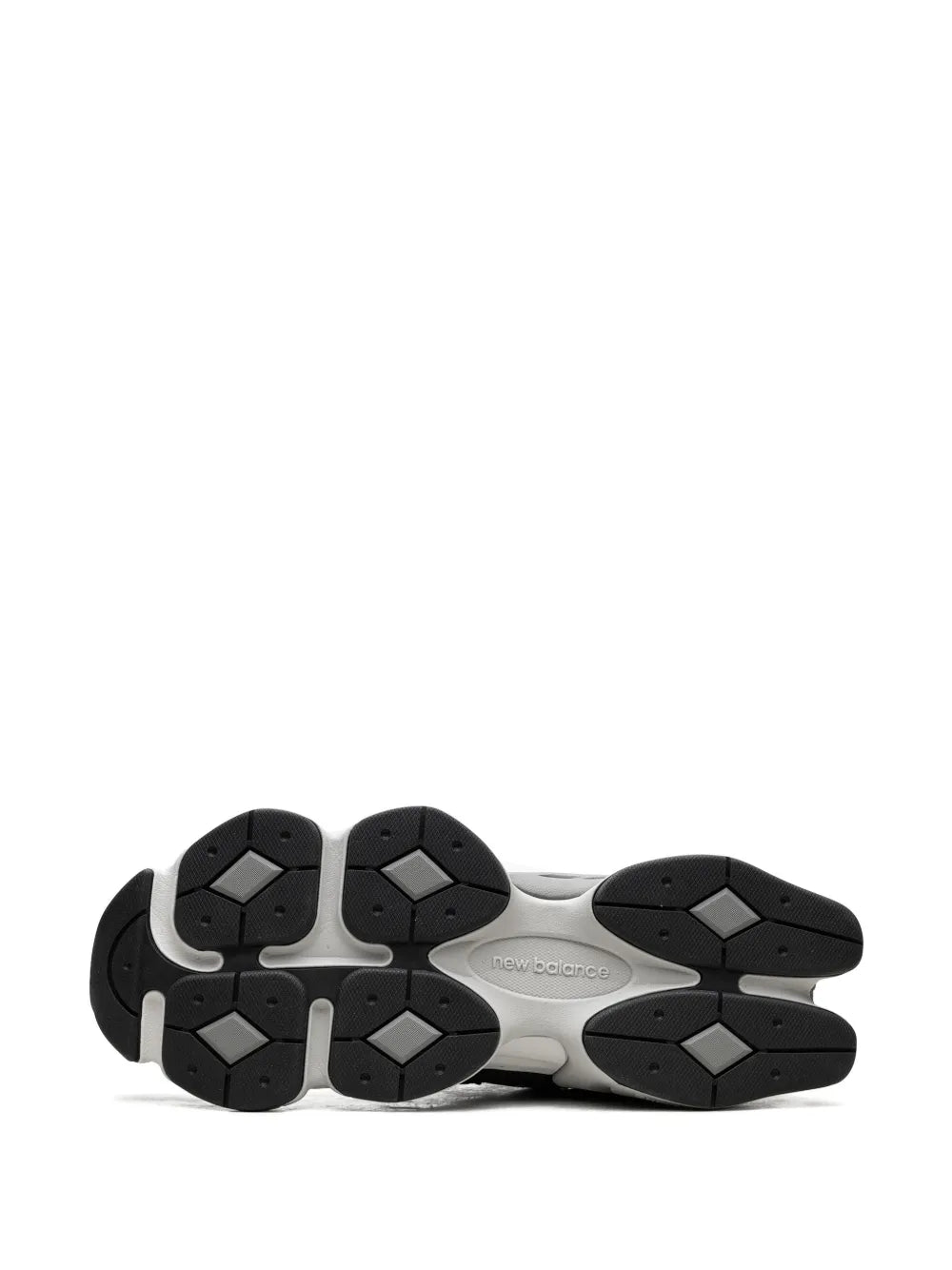 New Balance dark grey sneaker outsole with black multi-panel tread and new balance mark