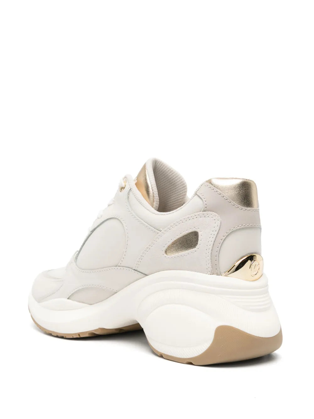 White leather sneakers with gold heel logo and thick ridged outsole