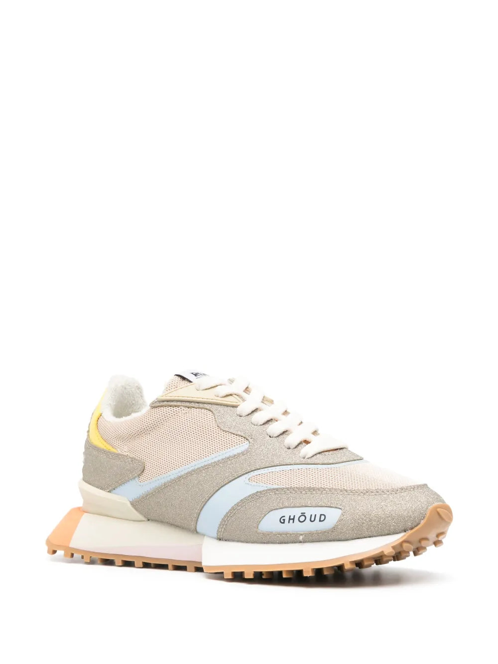 Beige mesh sneakers with gray and light blue side panels, yellow heel, orange outsole