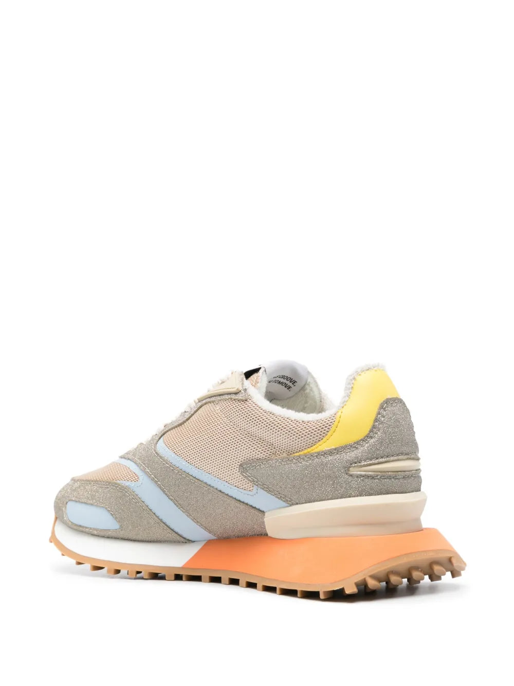 Beige and gray sneakers with yellow heel panel and chunky orange tread sole