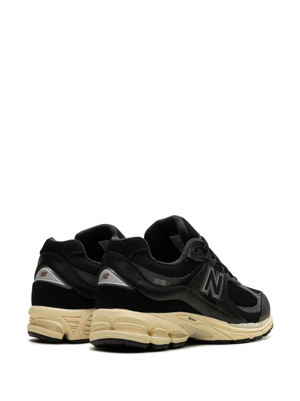 Black New Balance 2002R sneakers showing heel and side N logo, cream sole